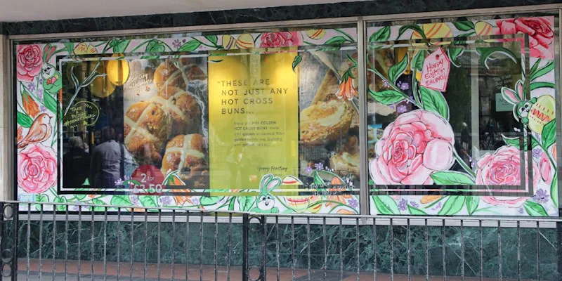 Window art for business - Easter floral border sounds shop window.